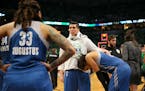Lynx center Janel McCarville comforted forward Maya Moore as the Lynx players waited to leave the court after Los Angeles beat the Lynx 77-76 in Game 