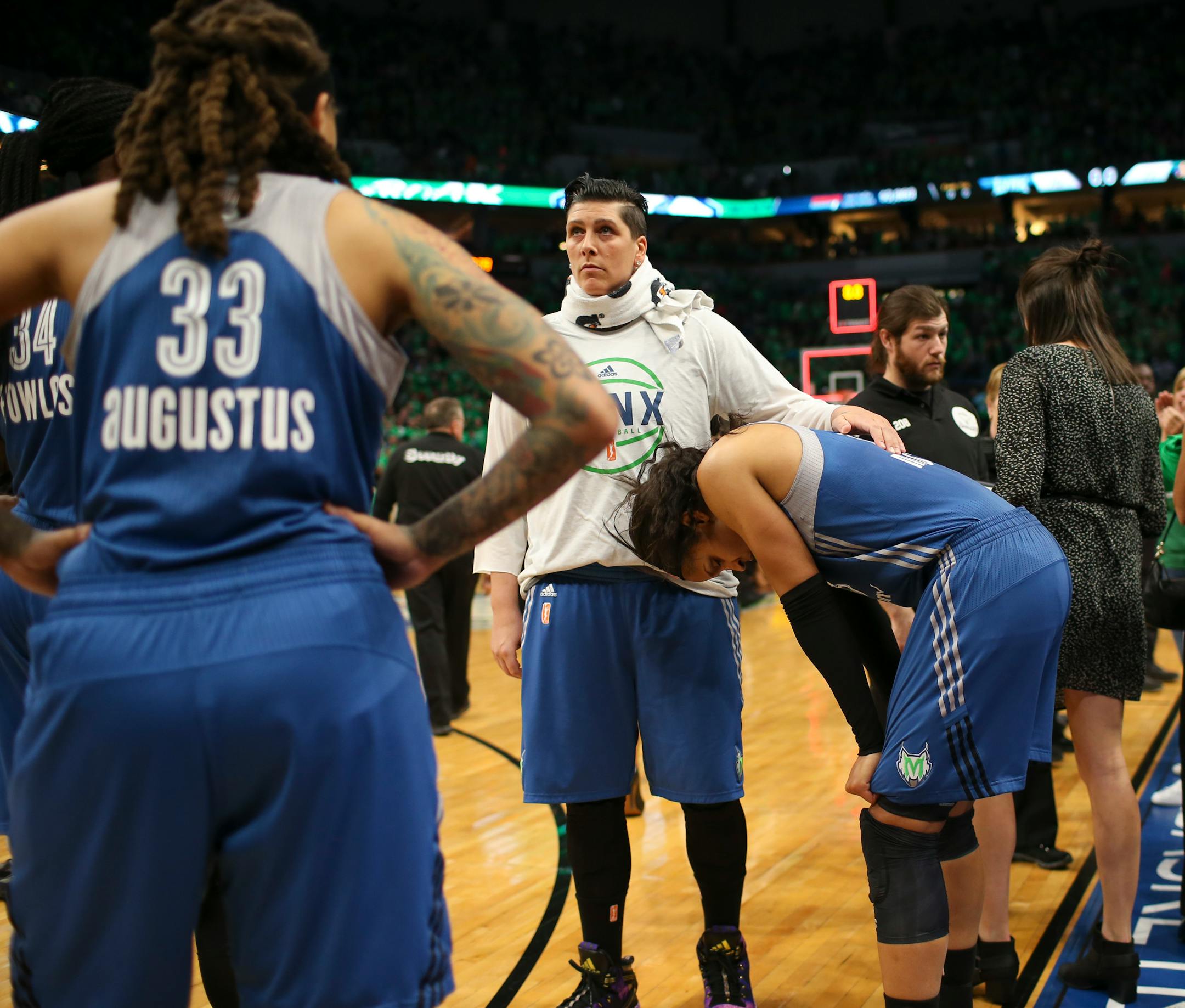 Lynx center Janel McCarville comforted forward Maya Moore as the Lynx players waited to leave the court after Los Angeles beat the Lynx 77-76 in Game 5 of the WNBA Finals at Target Center.