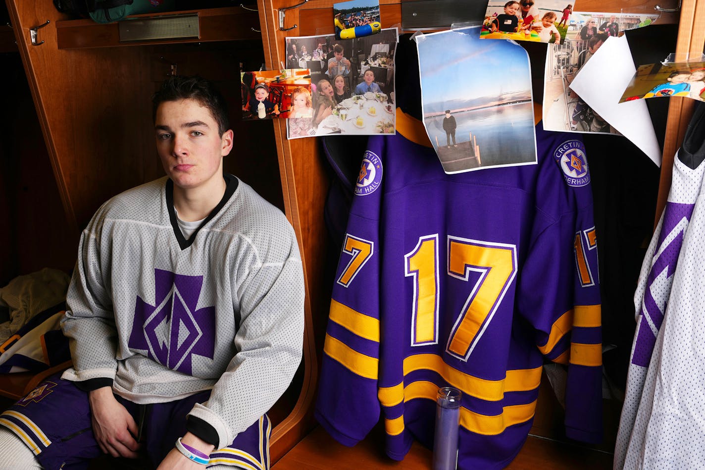 Colin Scanlan, whose younger brother Cormick died on Christmas Day after strokes caused by a rare disease, sits for a portrait near a locker left unchanged in memory of his brother Tuesday, March 7, 2023 at the Charles M. Schulz-Highland Arena in St. Paul, Minn. ] ANTHONY SOUFFLE • anthony.souffle@startribune.com