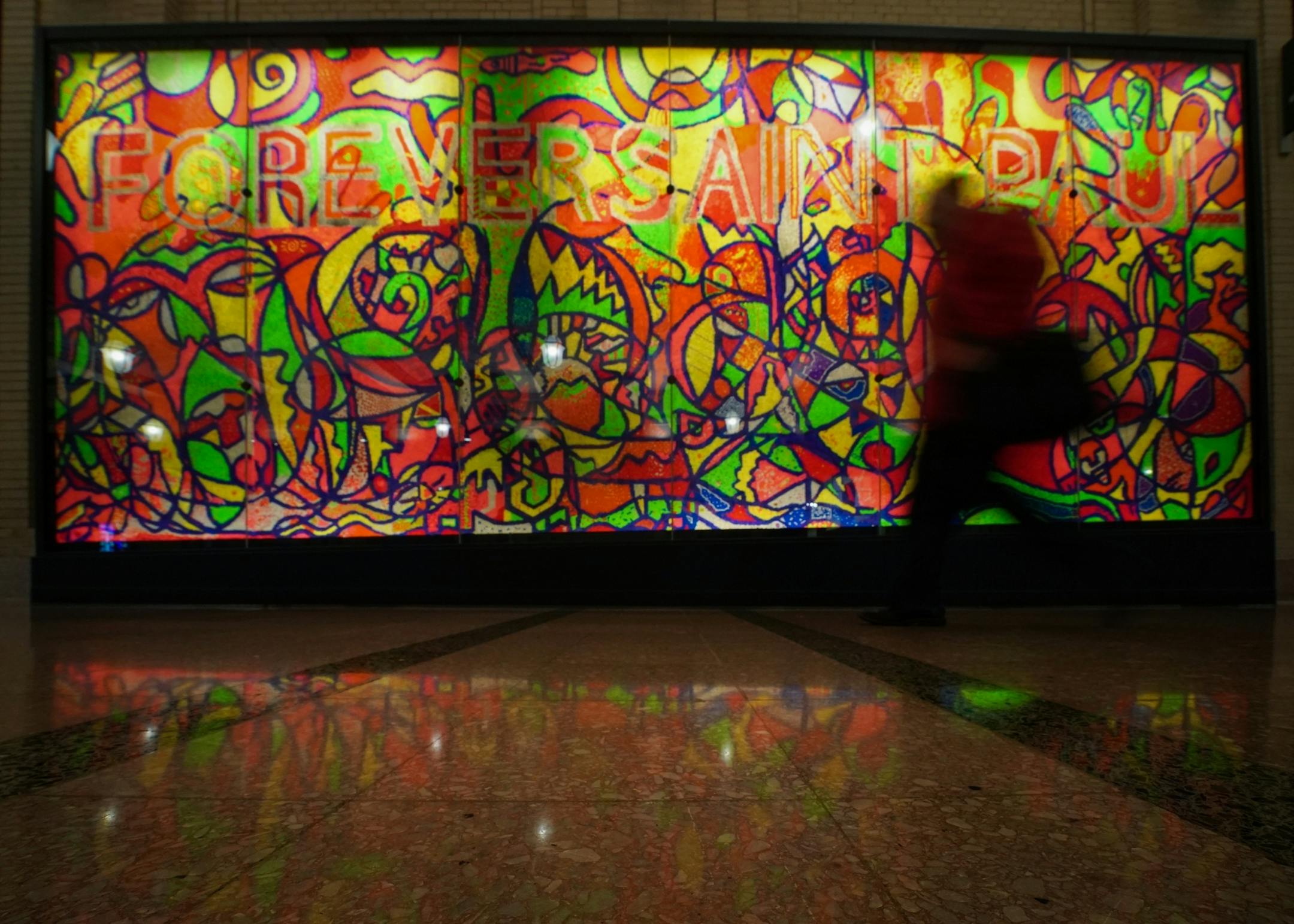 The Concourse is so named because it connects the Head House to the Waiting Room. Community-produced art adorns the walls of the Depot, including Ta-coumba T. Aiken's "Forever Saint Paul" mural in the depot's concourse. The 12-foot tall, 24-foot long mural made with approximately 600,000 pegs was named the Guiness Book of World Record for largest Lite-Brite picture.