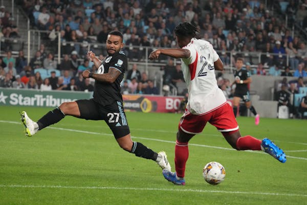 Minnesota United defender DJ Taylor (27) and New England Revolution forward DeJuan Jones (24) fought for the ball in a 1-1 draw on Sept. 9 at Allianz 