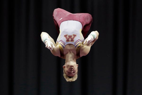 Shane Wiskus competes on the horizontal bar at the U.S. Gymnastics Championships on Saturday in Kansas City