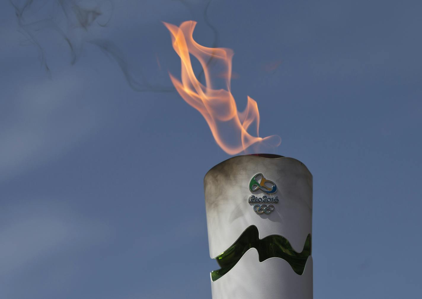 A lit torch of the Rio de Janeiro Olympic games during a dress rehearsal for the lighting of the Rio Olympics flame, in Ancient Olympia, southern Greece, on Wednesday, April 20, 2016. The meticulously choreographed ceremony will be repeated Thursday in the ruined birthplace of the ancient Olympics in southern Greece, in the presence of top International Olympic Committee and Rio organizing officials. That will touch off a relay that will conclude with the Rio Games opening ceremony in August. (A