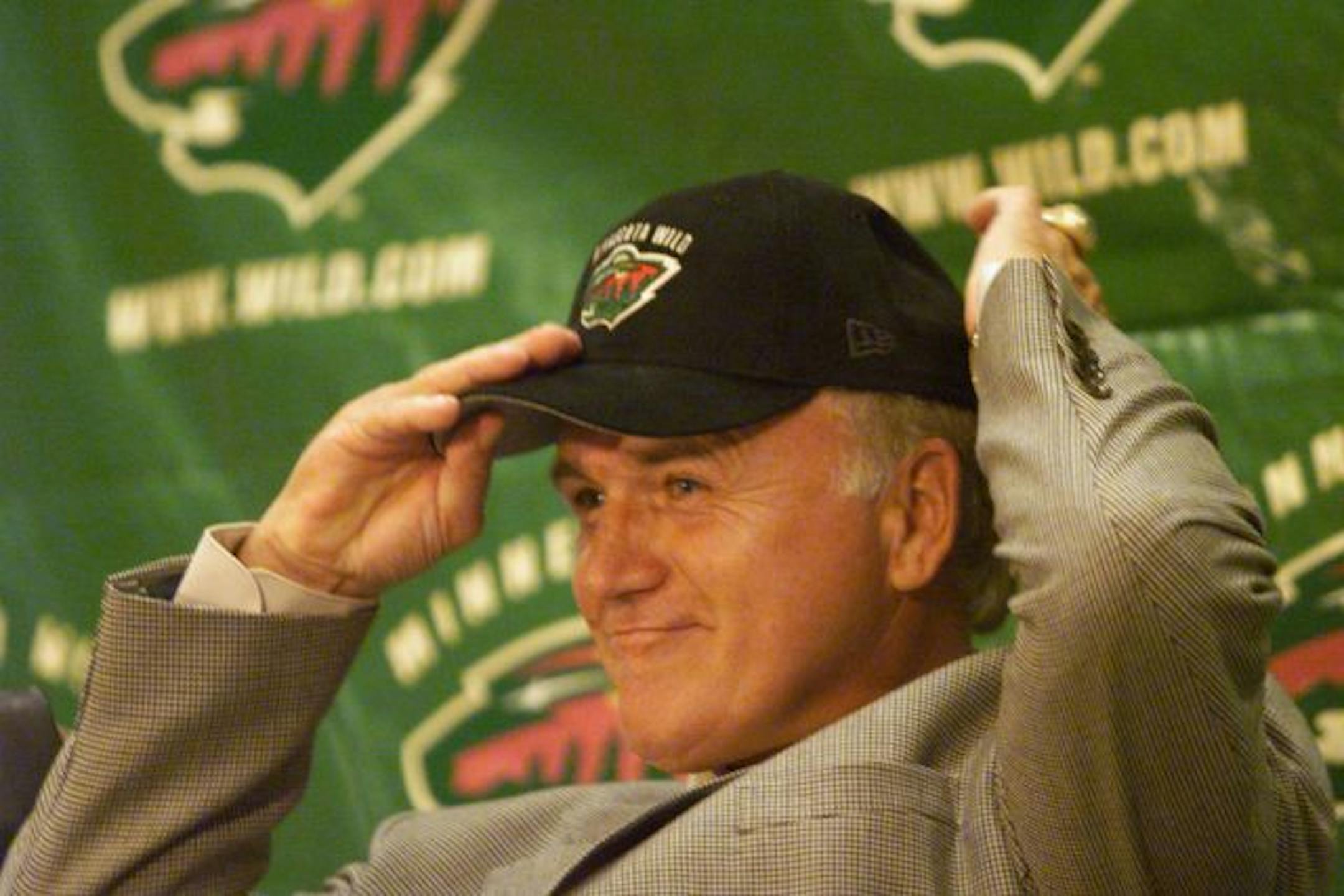 Wild to announce and make available their first head coach, Jacques Lemaire -- Jacques Lemaire tries on his new cap as it is announced that he will be the first head coach for the Minnesota Wild, Monday, June 19.