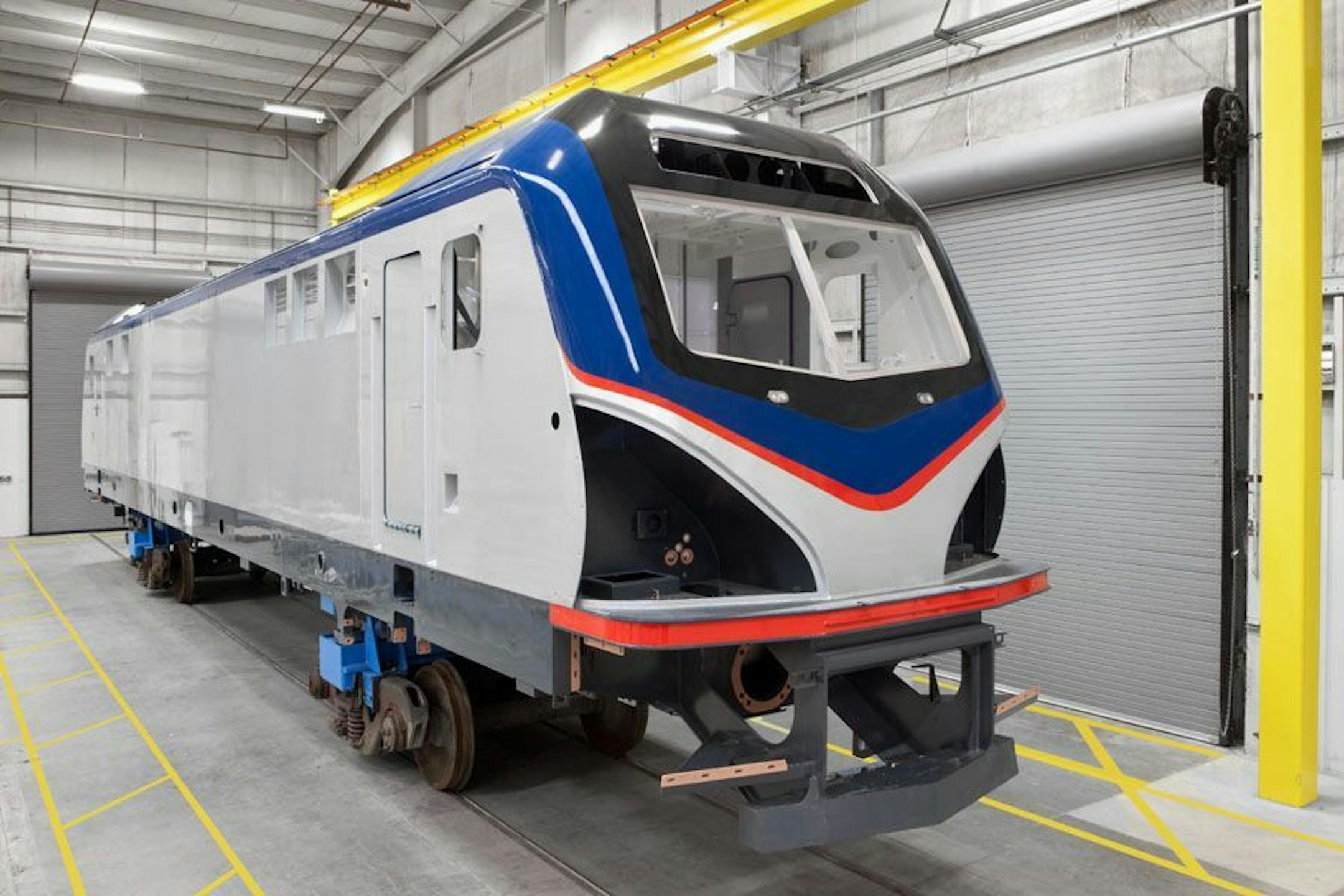 This undated handout photo provided by Amtrak shows the exterior of an electric Amtrak locomotive scheduled for delivery in 2013. Amtrak's fiscal 2012 operating loss was the lowest in nearly 38 years, which is a sign of progress, Joseph Boardman, the railroad's president and CEO, said Thursday. The $361 million loss for the year ending Sept. 30 was down 19 percent from the previous year. The last time Amtrak losses were less was 1975.