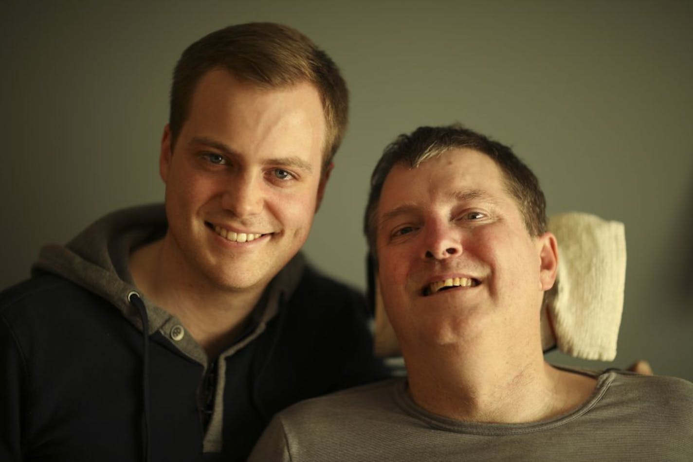 Collin Brown with is dad, Ken, at their family home in Champlin Tuesday afternoon.