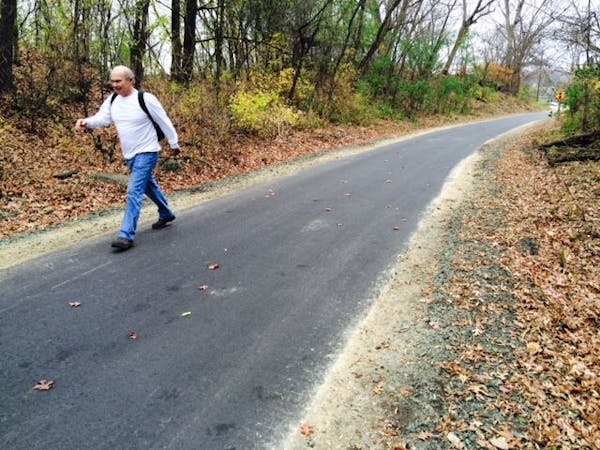 Paul Brown of Oak Park Heights was trying out the new Brown's Creek State Trail on Thursday near the trailhead in Stillwater. Signs said the trail was