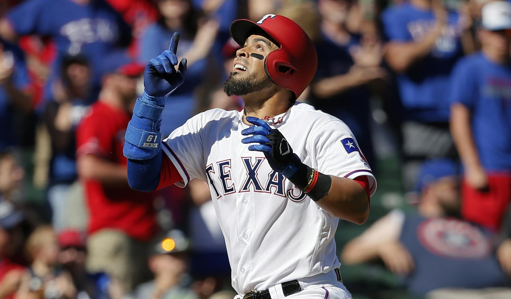 Texas Rangers' Robinson Chirinos celebrates his solo home run as he approaches the plate in the eighth inning of a baseball game against the Kansas City Royals in Arlington, Texas, Sunday, April 23, 2017. (AP Photo/Tony Gutierrez)