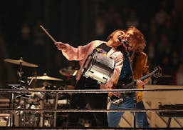 Guitarist Richard Reed Parry with William Butler early in Arcade Fire's set.