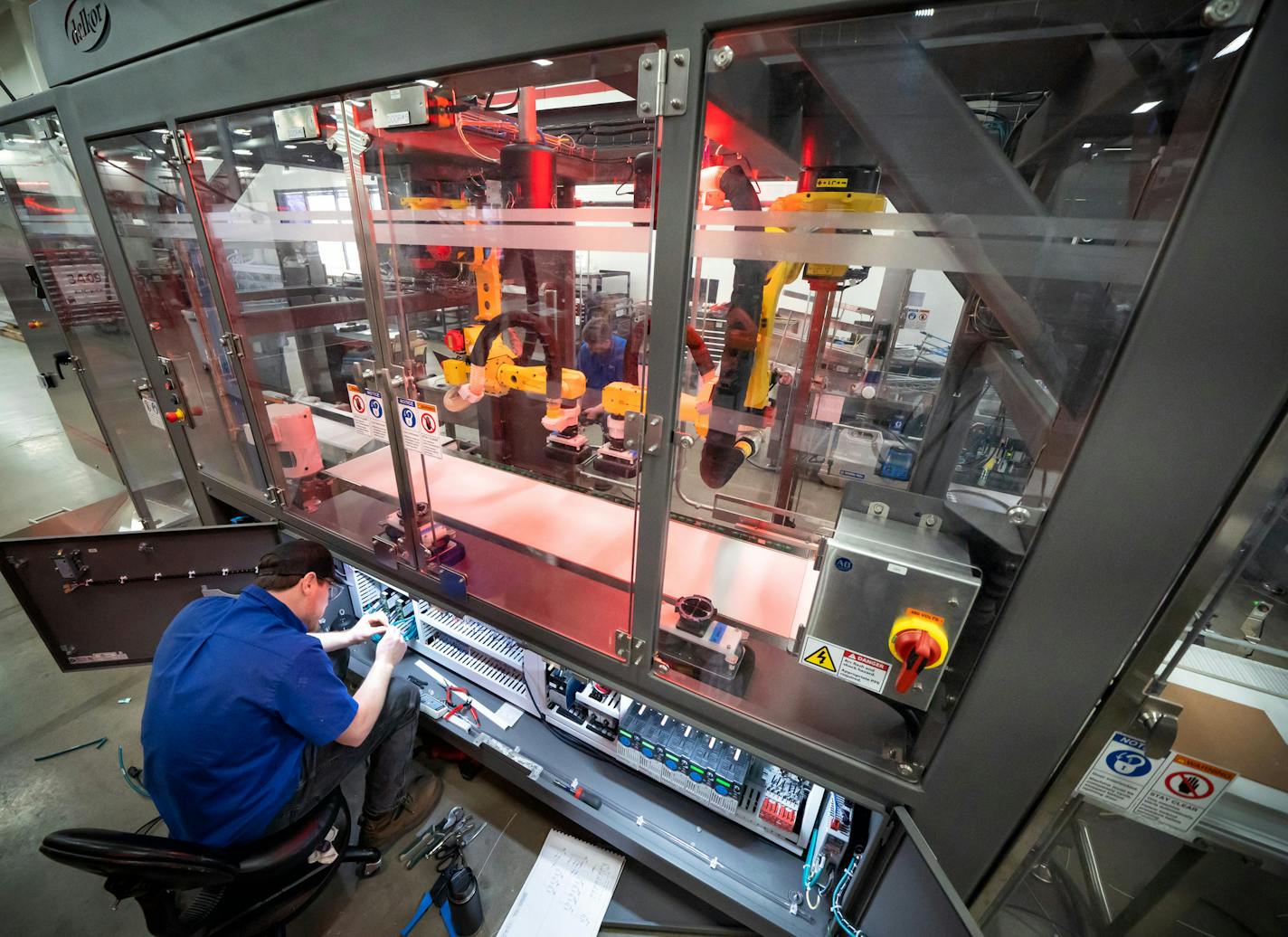 Dylon Eisele worked on the control panel of a case loader. Delkor&#x2019;s robotic packaging machines make shipping cartons and food boxes. ] GLEN STUBBE &#x2022; glen.stubbe@startribune.com Monday, April 8, 2019 Delkor&#x2019;s robotic packaging machines make shipping cartons and food boxes.