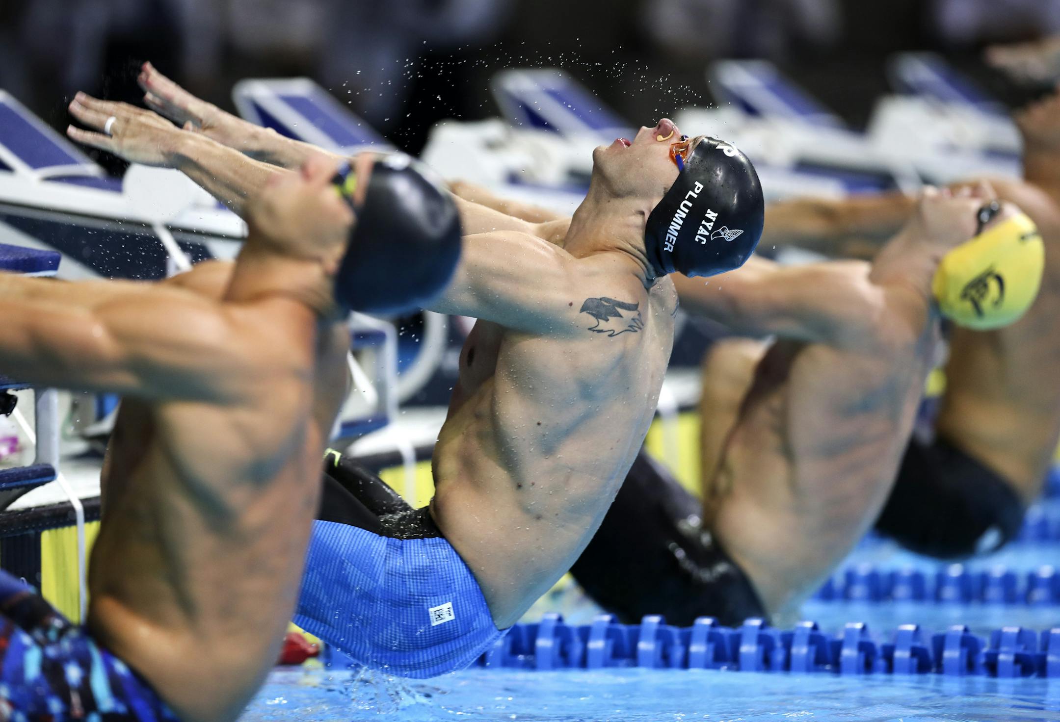 DAY 3 of the 2016 U.S. Olympic Swimming Trials- The former Gopher David Plummer swam the 100-meter backstroke in 52.28 seconds in Tuesday&#xed;s finals at the U.S. Olympic trials to earn a spot in next month&#xed;s games. He was second behind Ryan Murphy&#xed;s 52.26. Here, Plummer leaps from the blocks to start the race. Matt Grevers (left) and Ryan Murphy (right). ] 2016 U.S. Olympic Swimming Team Trialsbrian.peterson@startribune.comOmaha, NE - 06/28/2016