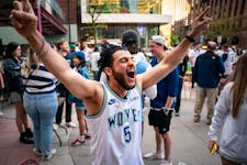 Aboude Elmir screams, “Wolves back baby!” at Kieran’s Irish Pub ahead of the Minnesota Timberwolves playoff game against the Denver Nuggets on F