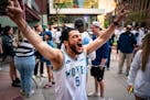 Aboude Elmir screams, “Wolves back baby!” at Kieran’s Irish Pub ahead of the Timberwolves playoff game against the Denver Nuggets on Friday.