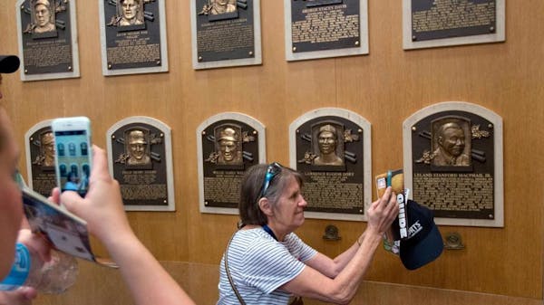 Fans touring the baseball Hall of Fame gallery in Cooperstown, N.Y.