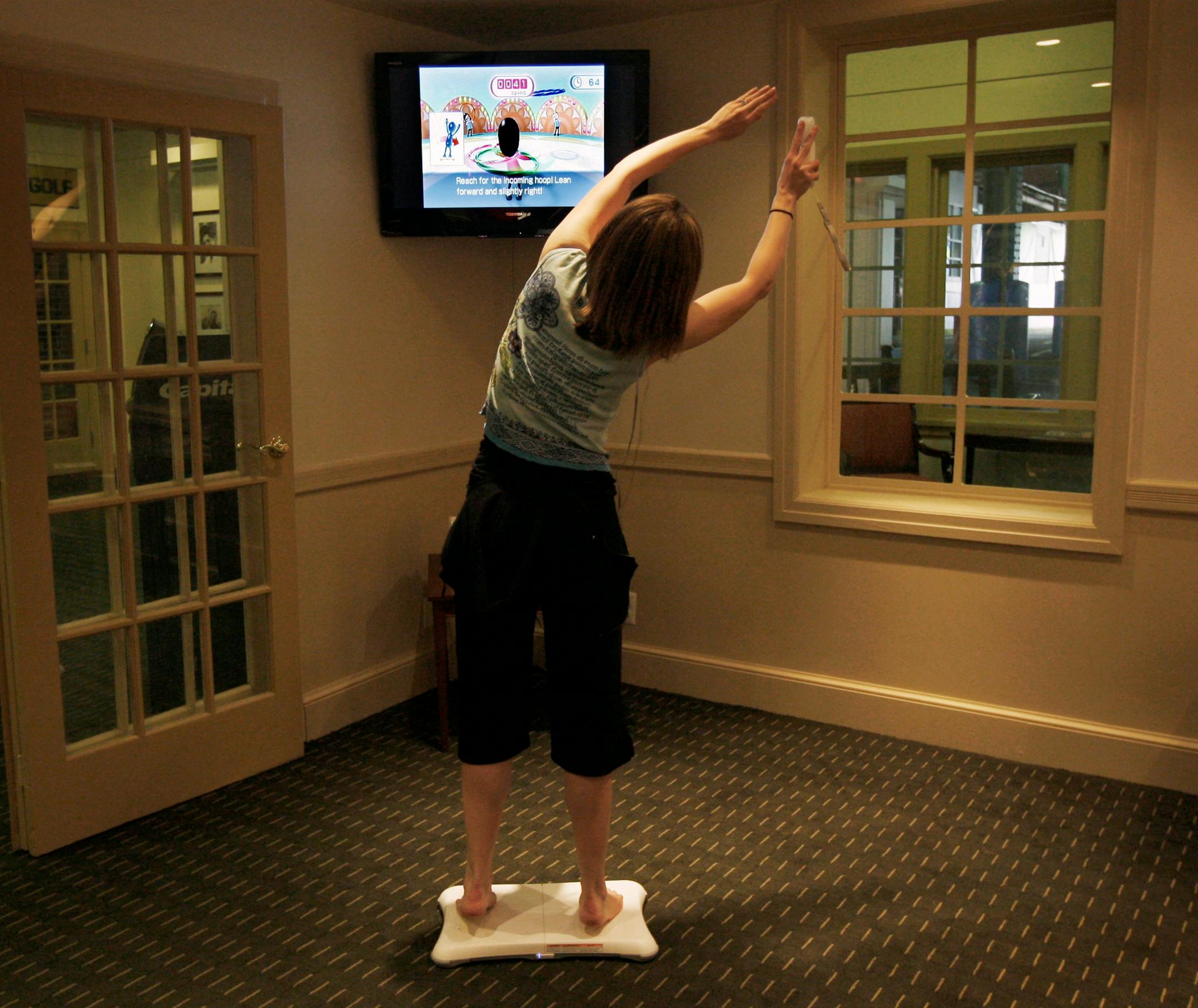 Shira Weiss, 33, a mother with two children, tests the yoga programs that the Wii Fit offers, at the Chelsea Piers sports complex in Manhattan.