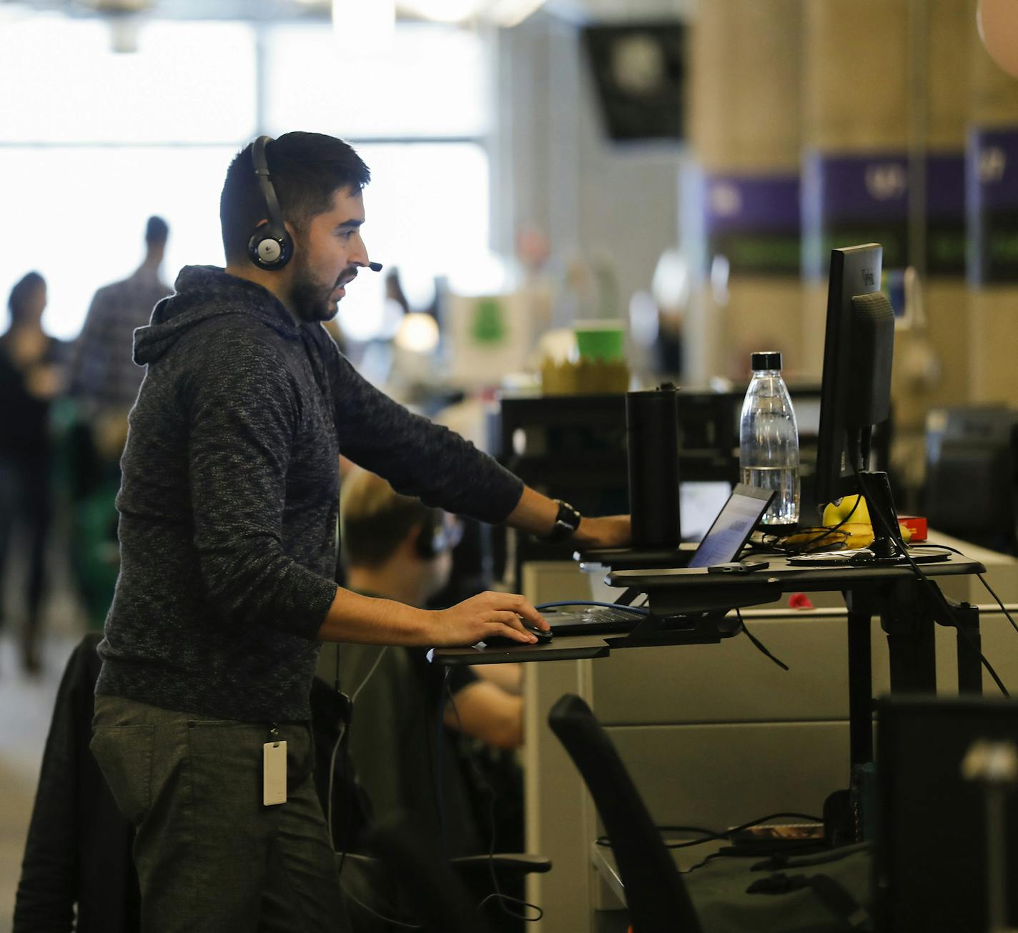 Piero Soria, a data analyst for global services operations, stands at his desk as he works at Groupon in Chicago on Wednesday, Nov. 14, 2018. The story is for Groupon's 10-year anniversary. (Jose M.Osorio/Chicago Tribune/TNS) ORG XMIT: 1247216