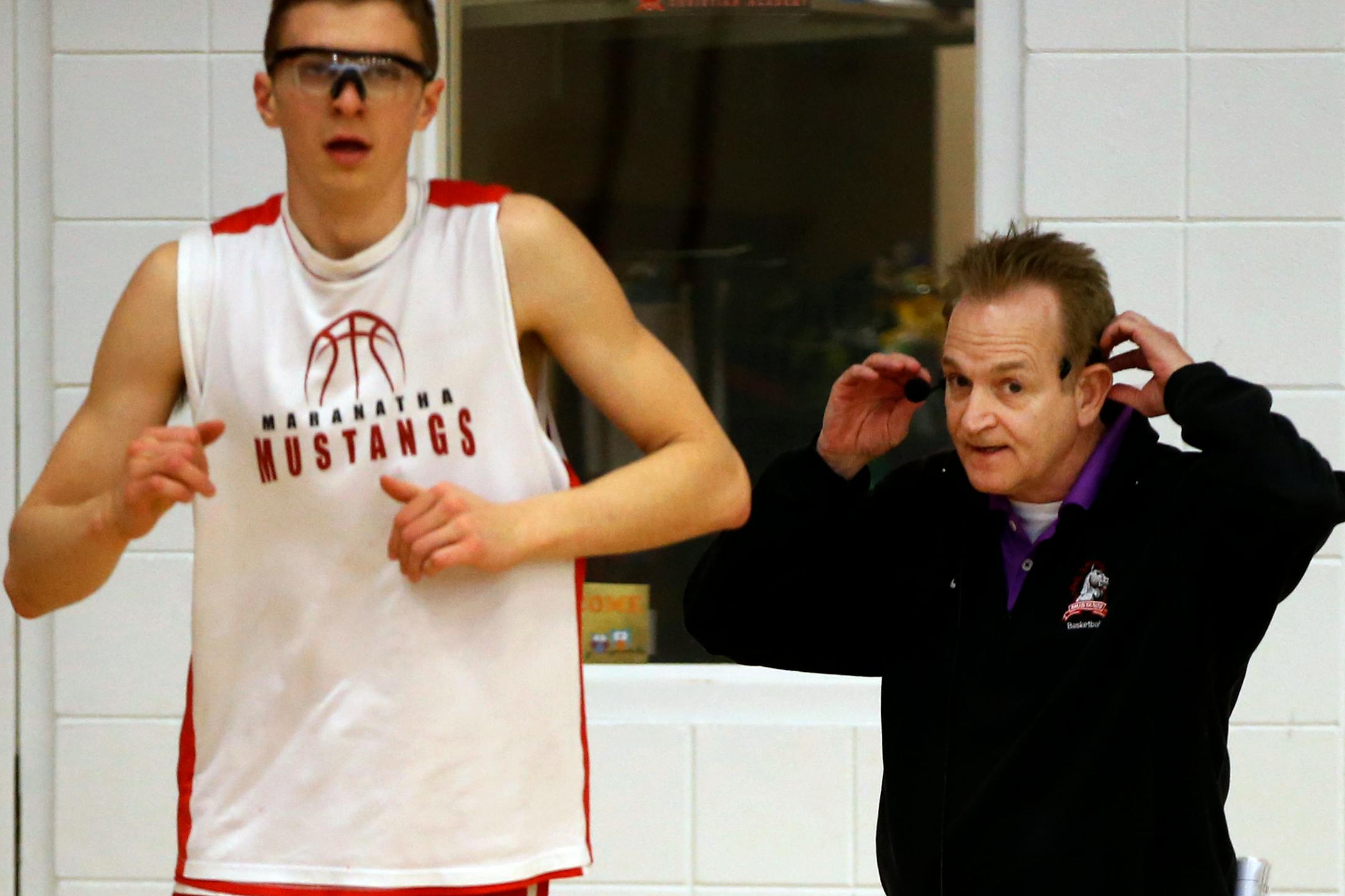 Senior forward Jeremiah Hanson and coach Jeff Wall of Maranatha's boys' basketball team (Richard Tsong-Taatarii, Star Tribune)