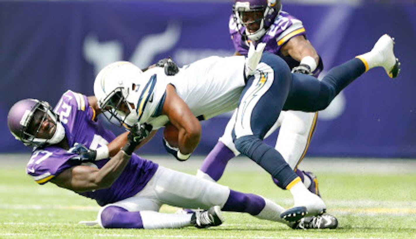 Vikings safety Jayron Kearse, left, tackled San Diego wide receiver Rasheed Bailey during the third quarter Sunday.