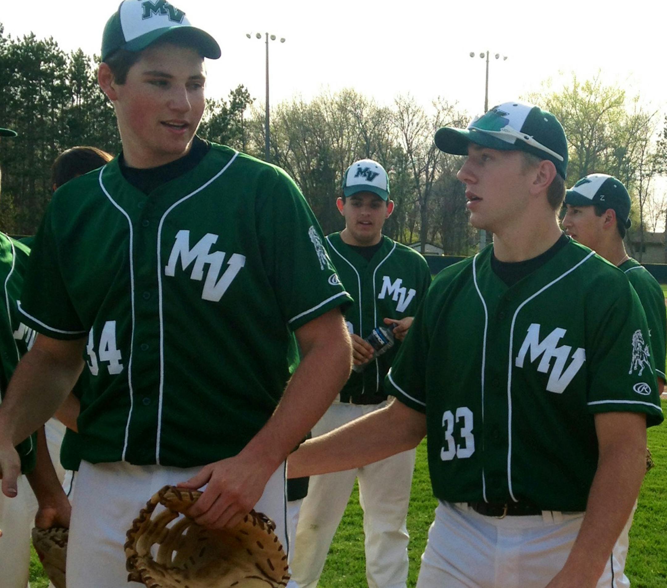 Jason Gonzalez/Star Tribune Mounds View junior pitcher Sam Hentges, left, is congratulated by senior Max Knutson, right, after a 4-1 win in Game 1 of a doubleheader at Forest Lake. Hentges got the win and hit a home run in Game 1. Knutson pitched Game 2 and gave up just one run over seven innings.