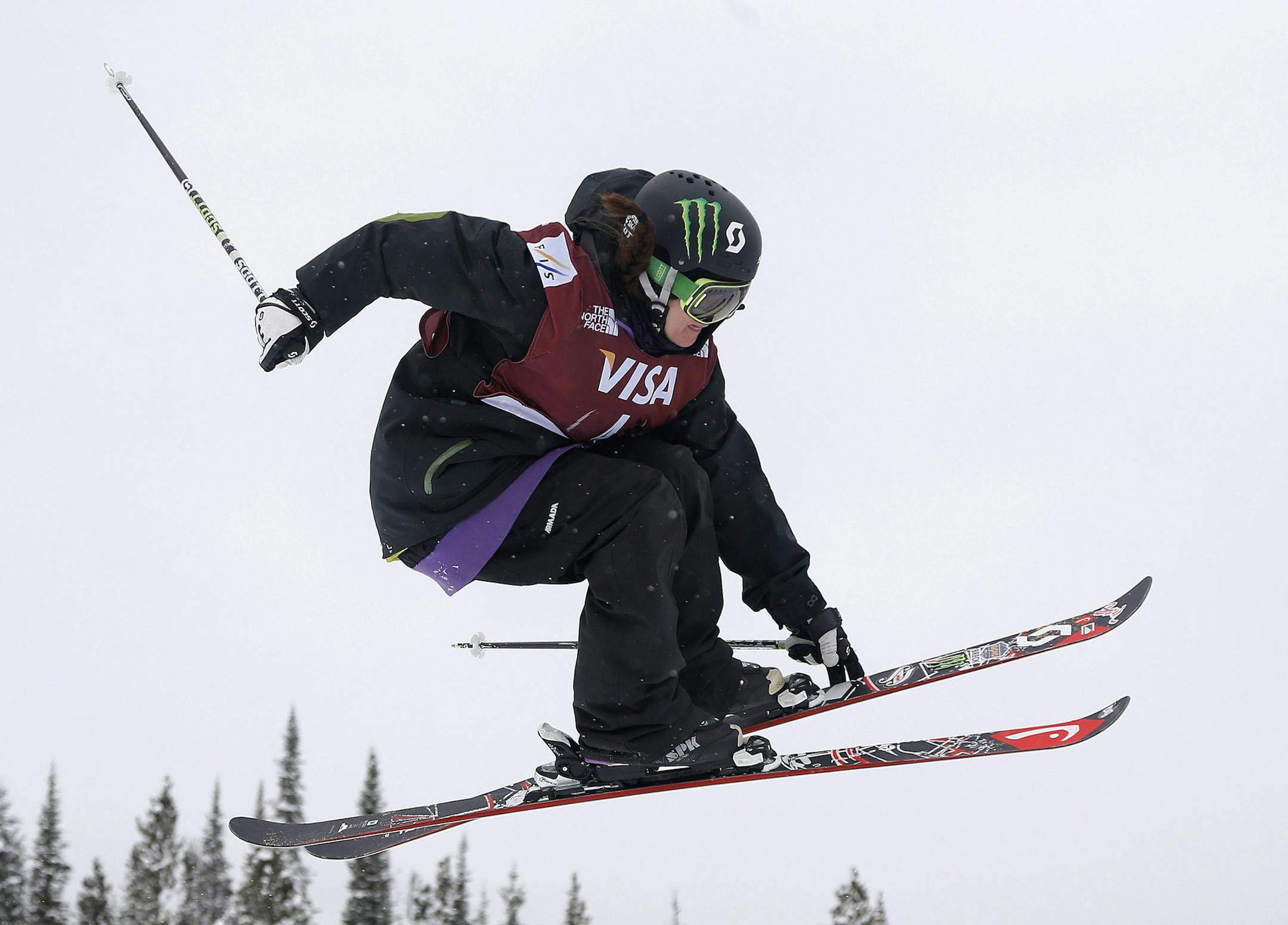 Keri Herman, of the United States, grabs a ski off a jump during the World Cup U.S. Grand Prix slopestyle freestyle skiing finals, Saturday, Dec. 21, 2013, in Frisco, Colo. (AP Photo/Julie Jacobson) ORG XMIT: COJJ126