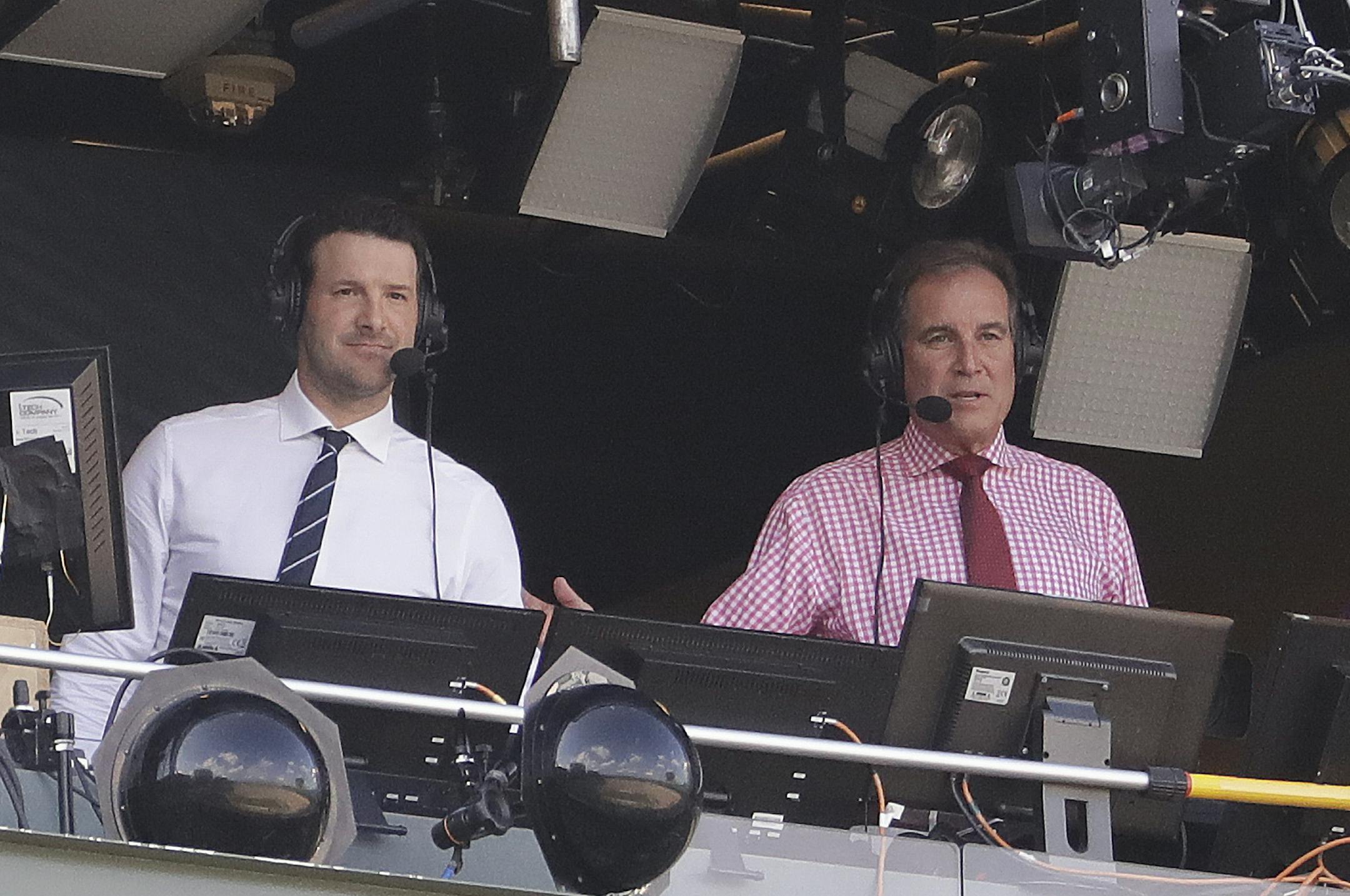 Tony Romo and Jim Nantz are seen in the broadcast boothnbefore an NFL football game between the Green Bay Packers and the Cincinnati Bengals Sunday, Sept. 24, 2017, in Green Bay, Wis. (AP Photo/Morry Gash) ORG XMIT: WIMG114