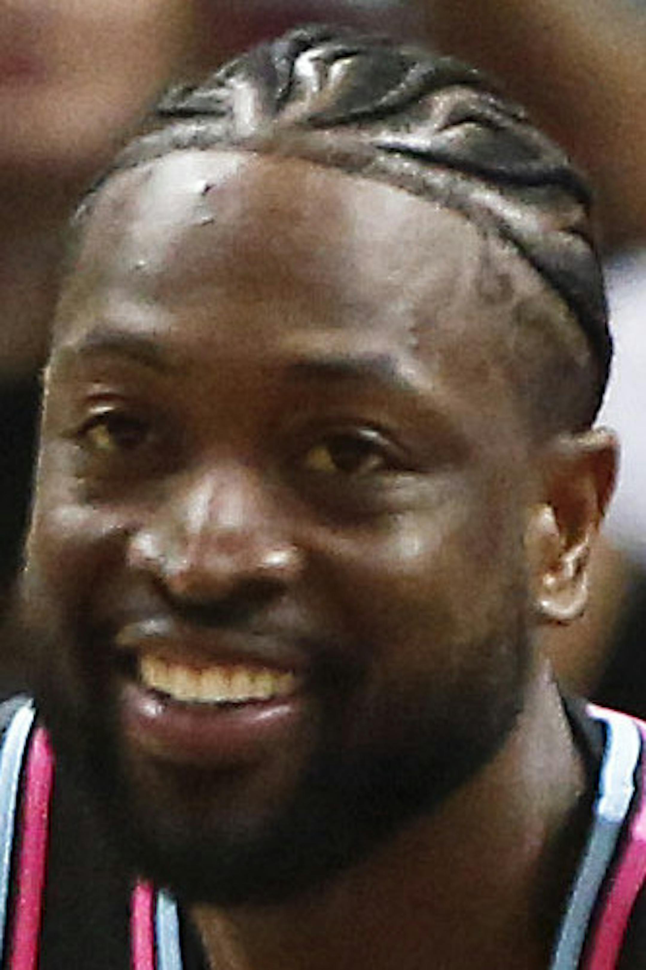 Miami Heat guard Dwyane Wade (3) smiles after he dunks the ball against the Golden State Warriors during the first half of an NBA basketball game Wednesday, Feb. 27, 2019, in Miami. (AP Photo/Brynn Anderson)