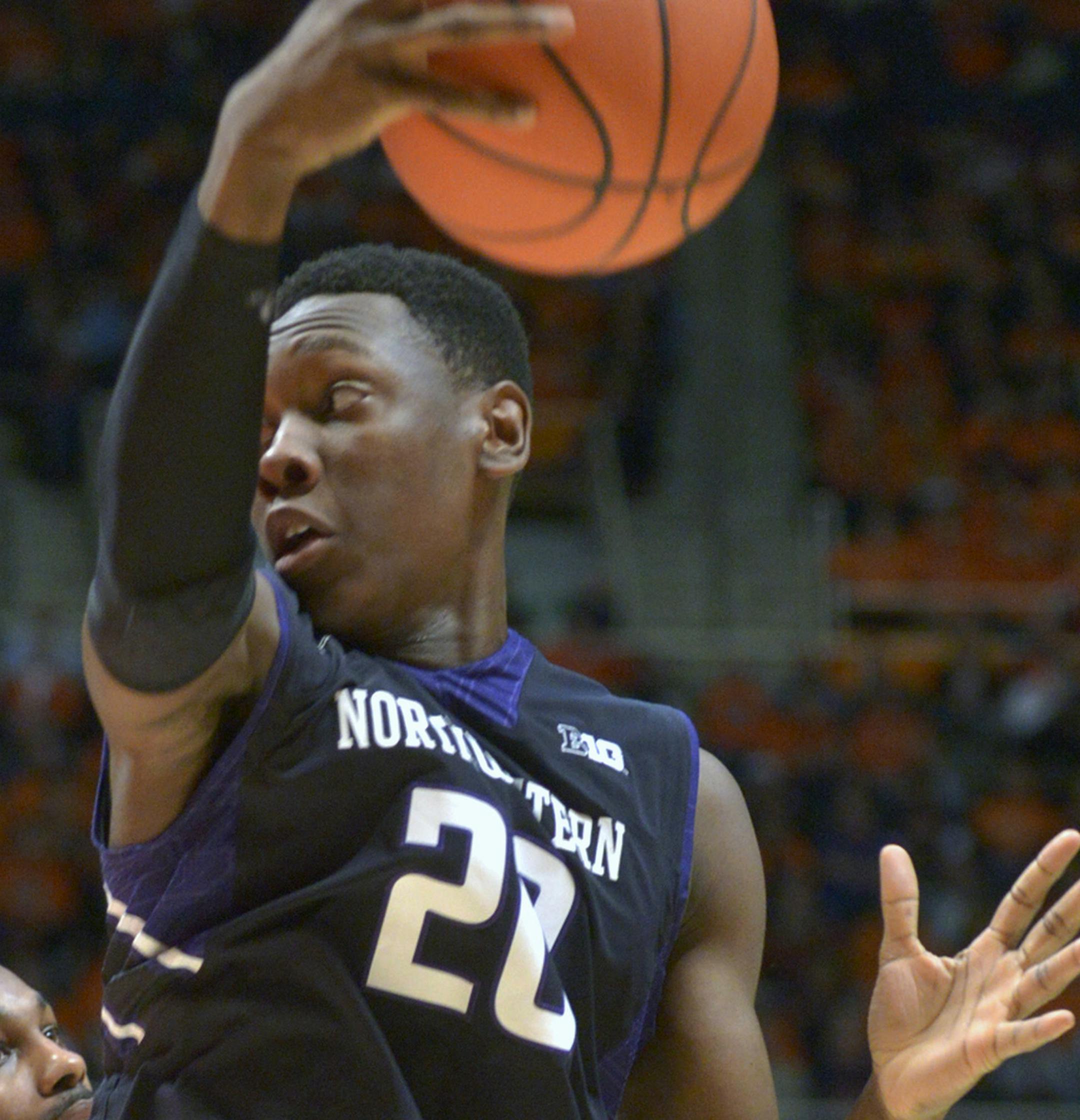 Northwestern's guard/forward Scottie Lindsey (20) keeps the ball away from Illinois' guard Ahmad Starks (3) during the second half of an NCAA college basketball game in Champaign, Ill., Saturday, Feb. 28, 2015. Illinois won, 86-60.(AP Photo/Robin Scholz) ORG XMIT: ILRS107