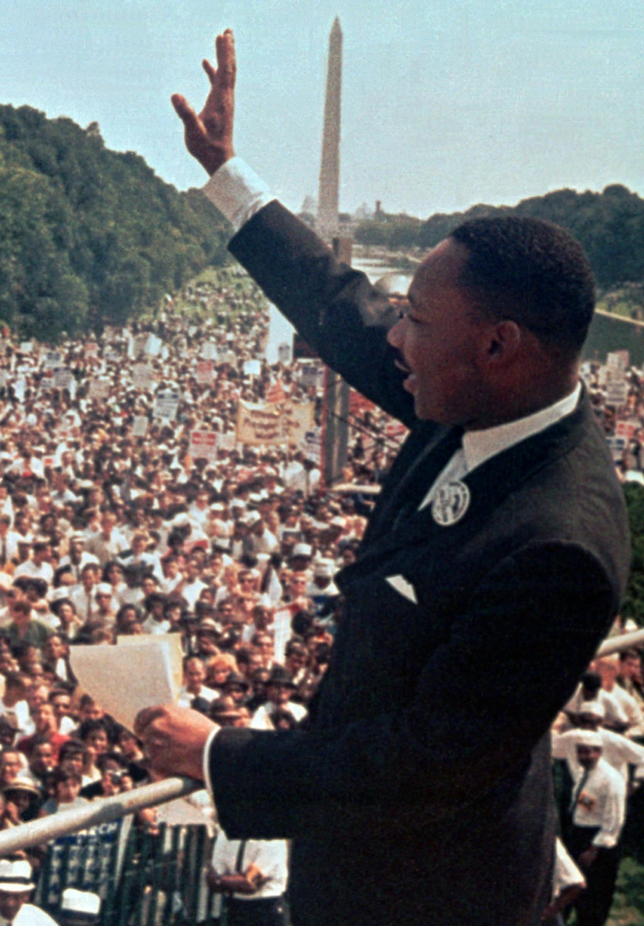 The Rev. Martin Luther King Jr. waves to the crowd at the Lincoln Memorial for his “I Have a Dream” speech during the March on Washington.