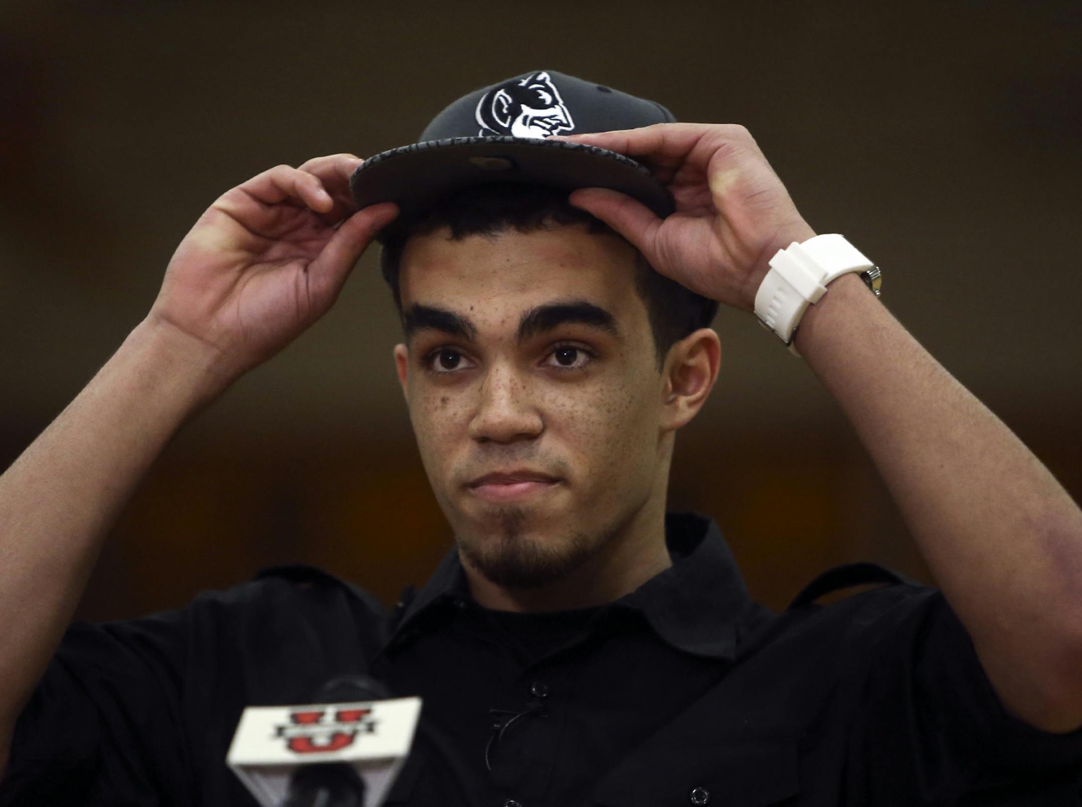 Apple Valley basketball phenom Tyus Jones donned a Duke University Blue Devils hat while announcing he would be attending Duke University during a live ESPN televised special Friday, Nov. 15, 2013, at Apple Valley High in Apple Valley, MN.