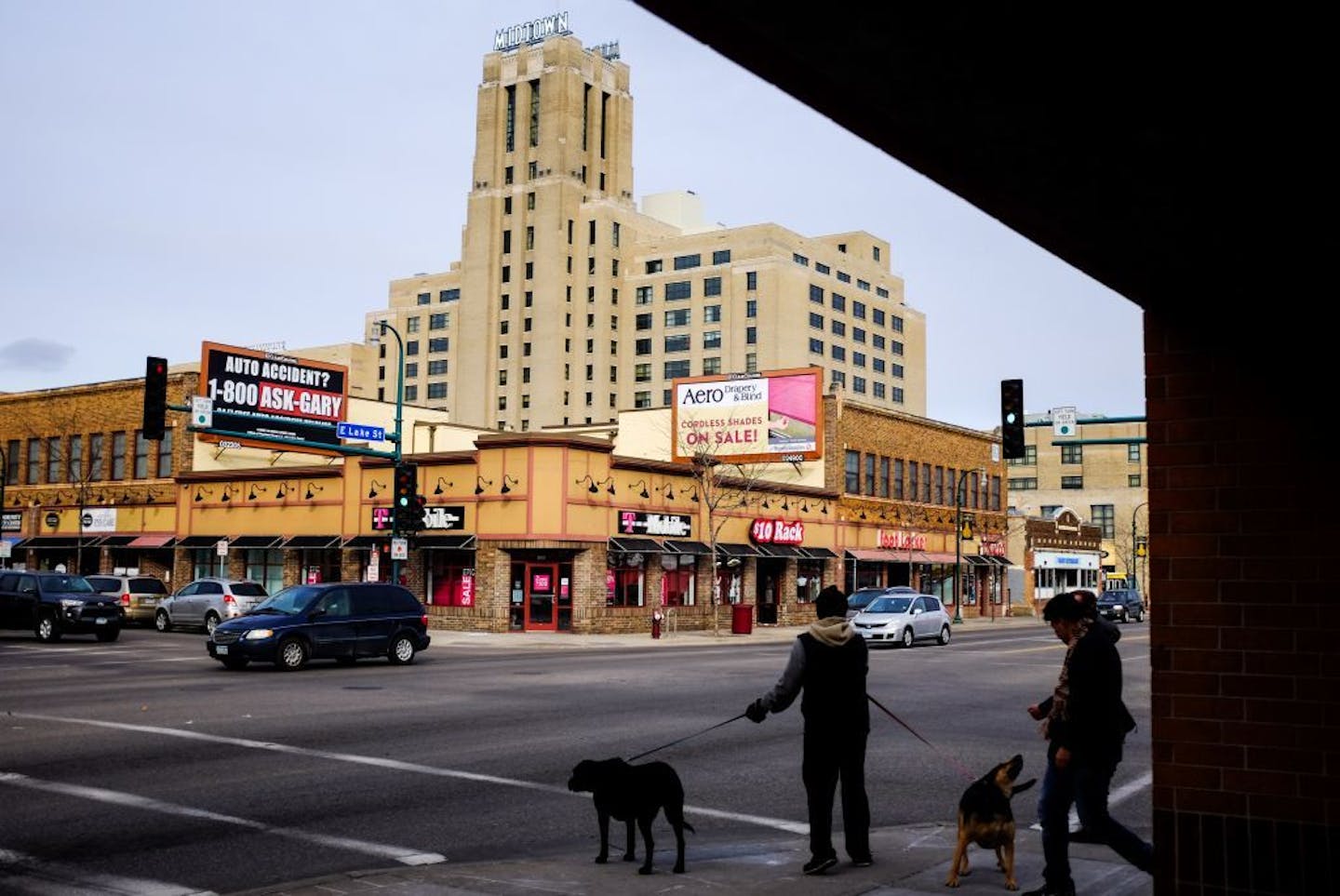 Pedestrians waited to cross East Lake Street near Midtown Global Market Friday night.