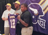 Vikings coach Dennis Green (center) poses for a picture with 1999 draft picks Jimmy Kleinsasser (left) and Daunte Culpepper.