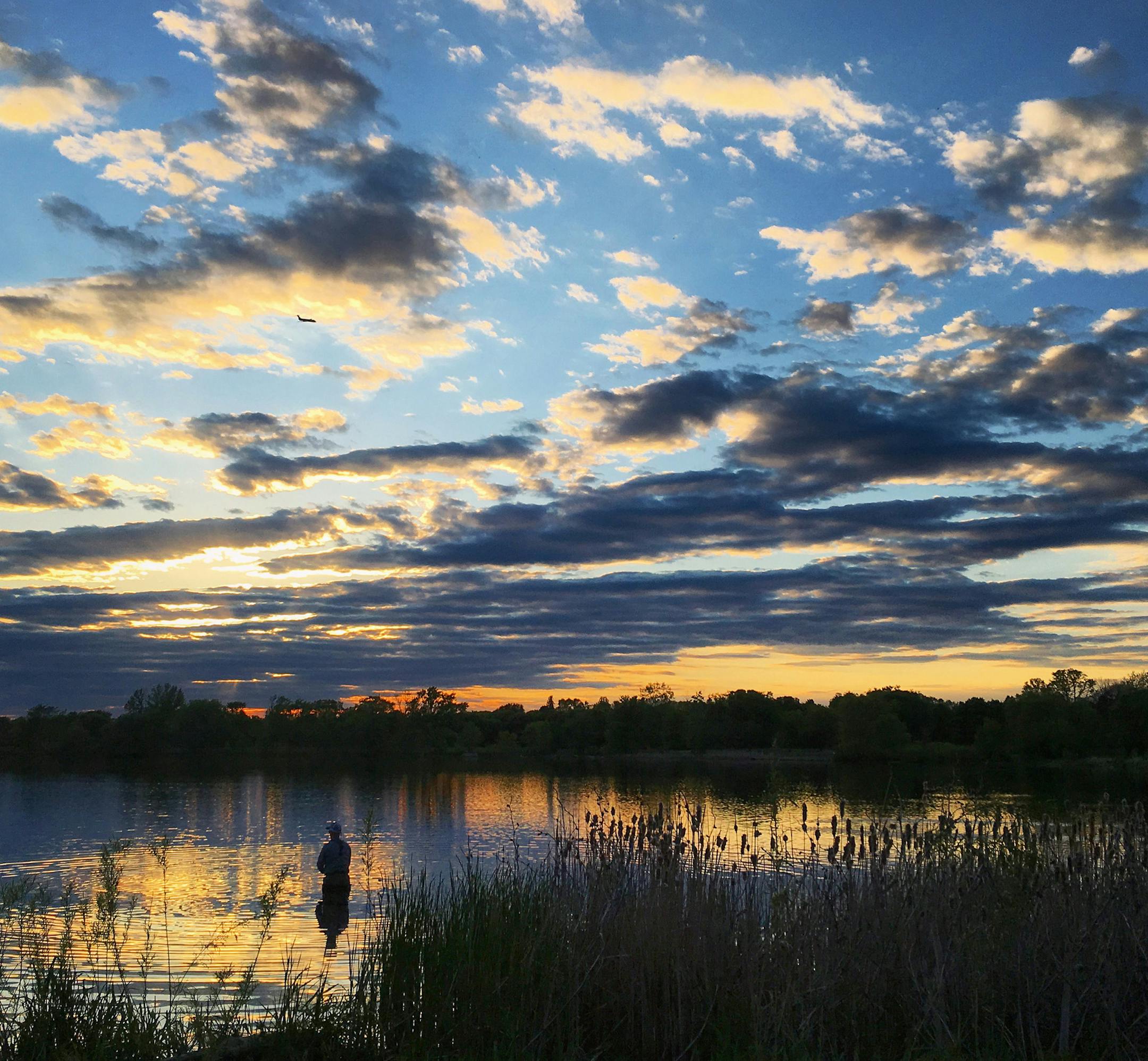 Brianna Pahl (@yayoubetcha) caught a view of a sunset — and a fisherman on Lake Hiawatha in Minneapolis at her "favorite secret sunset spot."