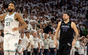 Luka Doncic of the Mavericks, right, lets Wolves center Rudy Gobert know about his game-winning three-pointer on Friday night at Target Center.