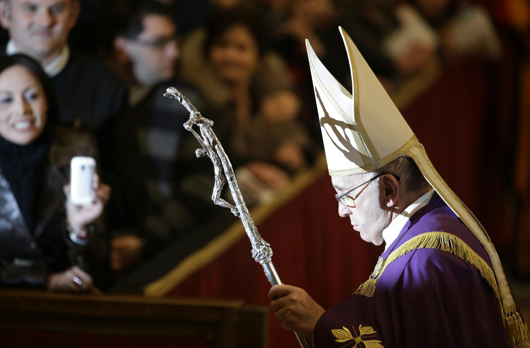 Pope Francis holds his pastoral staff as he attends a Penitence Mass in St. Peter's Basilica at the Vatican, Friday, March 13, 2015. Francis announced a special Jubilee Year to focus the church on his main priority as pope: mercy. It's only the 27th time in the history of the church that there has been a Holy Year. (AP Photo/Andrew Medichini)