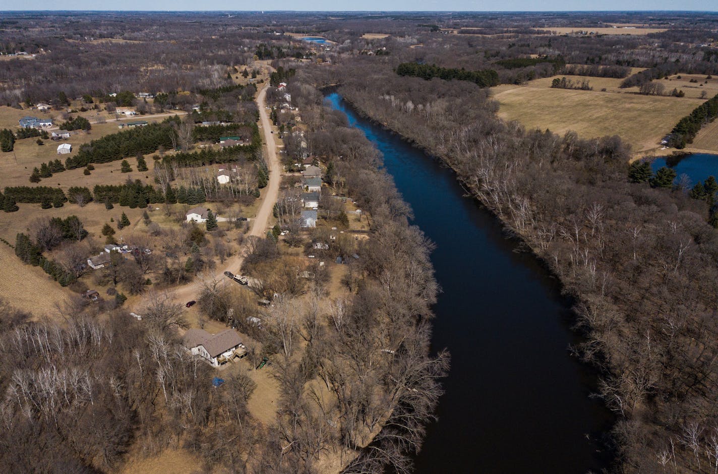 The Rum River's wild and scenic designation limits the density of development along it's banks. The City of St. Francis hoped to develop the fields and wooded land on the right side of the river. ] MARK VANCLEAVE &#xa5; The Rum River is one of six protected under Minnesota' wild and scenic river program, but the city of St. Francis wants the state to loosen its rules for development along its stretch of the Rum. Photographed Tuesday, Apr 16, 2019.