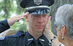 An officer teared up at the funeral for Mendota Heights police officer Scott Patrick in 2014. After the shooting, West St. Paul officers involved in t