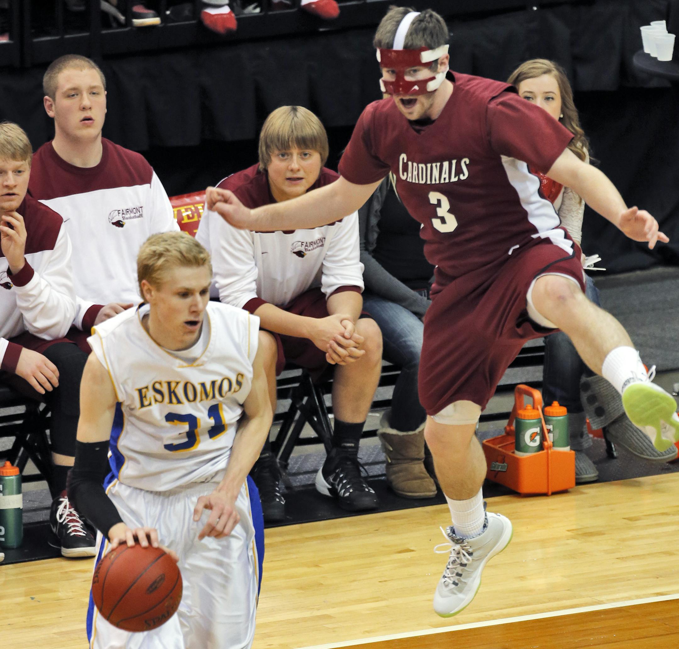 Esko's Kory Deadrick (31) faked Fairmont defender Mitch Pfingsten into the air. ] Class 2A Boys State Basketball Tournament - Esko Eskomos vs. Fairmont Cardinals (MARLIN LEVISON/STARTRIBUNE(mlevison@startribune.com)