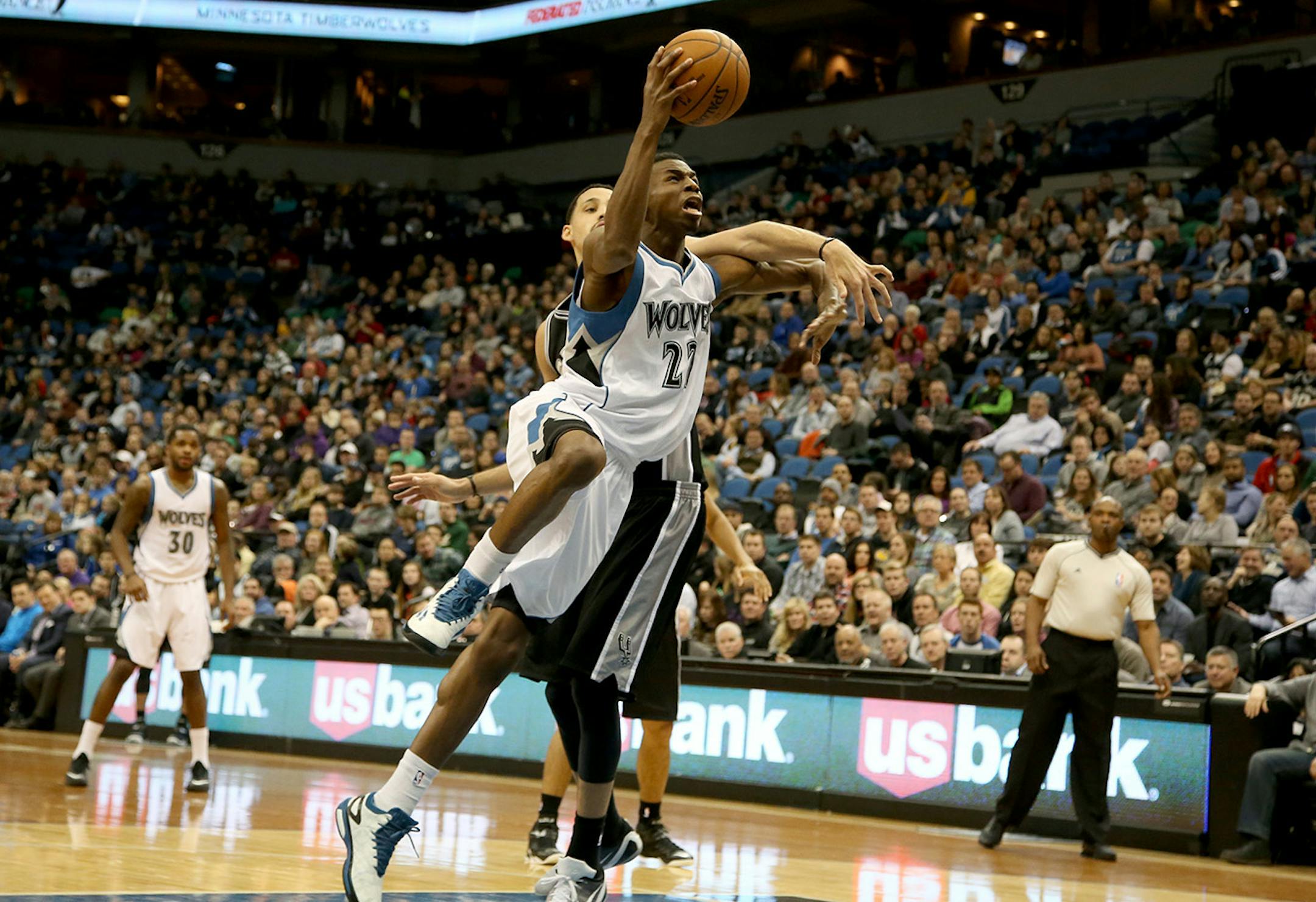 The Wolves Andrew Wiggins got fouled going to the basketball by Spurs Austin Daye during the second half. ] (KYNDELL HARKNESS/STAR TRIBUNE) kyndell.harkness@startribune.com Timberwolves vs San Antonio at the Target Center in Minneapolis Min., Saturday, January 10, 2014. Spurs won over the Wolves 108-93.