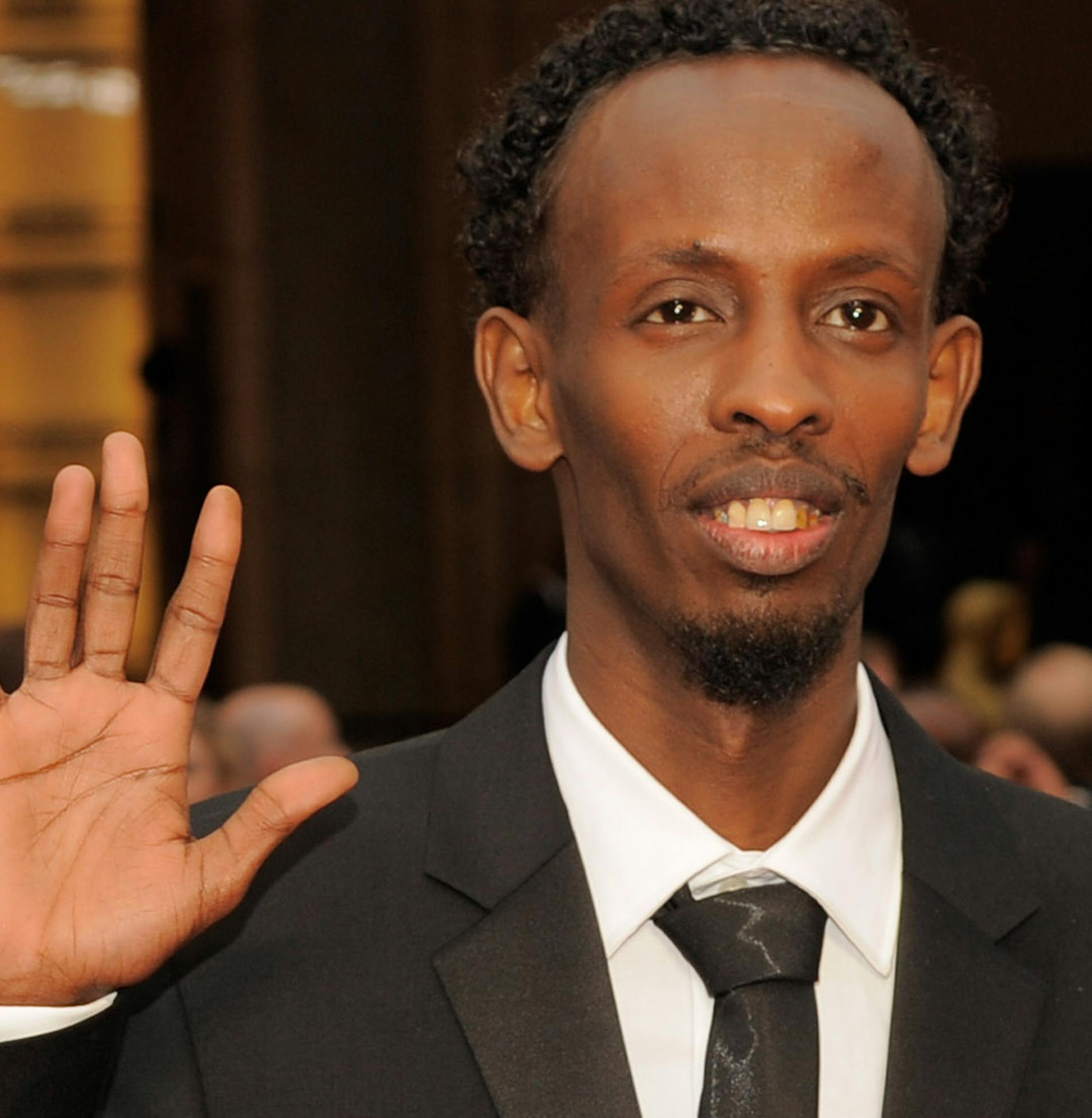 Barkhad Abdi arrives at the Oscars on Sunday, March 2, 2014, at the Dolby Theatre in Los Angeles. (Photo by Chris Pizzello/Invision/AP)