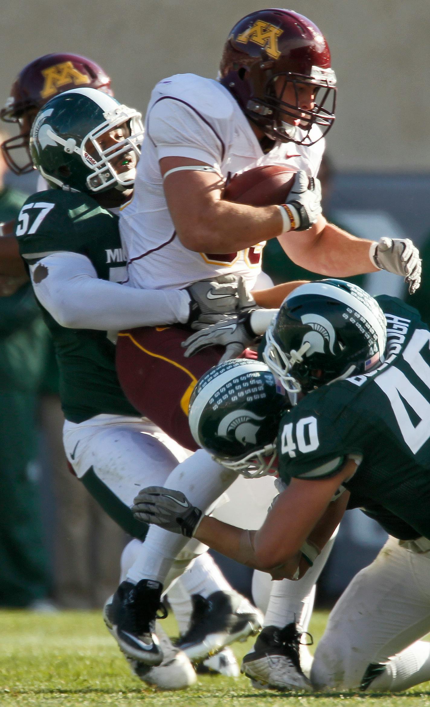 Gophers fullback Jon Hoese (shown carrying the ball against Michigan State) ran for three touchdowns against Middle Tennessee State in the Gophers' only victory of the season. The scores, which came with his dad in the hospital, doubled his career total. Days later, Terry Hoese died, and weeks later the coach that supported Jon Hoese and his family was fired.