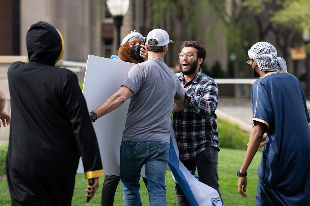 A moment of tension broke out between pro-Israel and pro-Palestinian demonstrators on the University of Minnesota campus Friday. Two U police officers showed up to ensure there were no more altercations.

