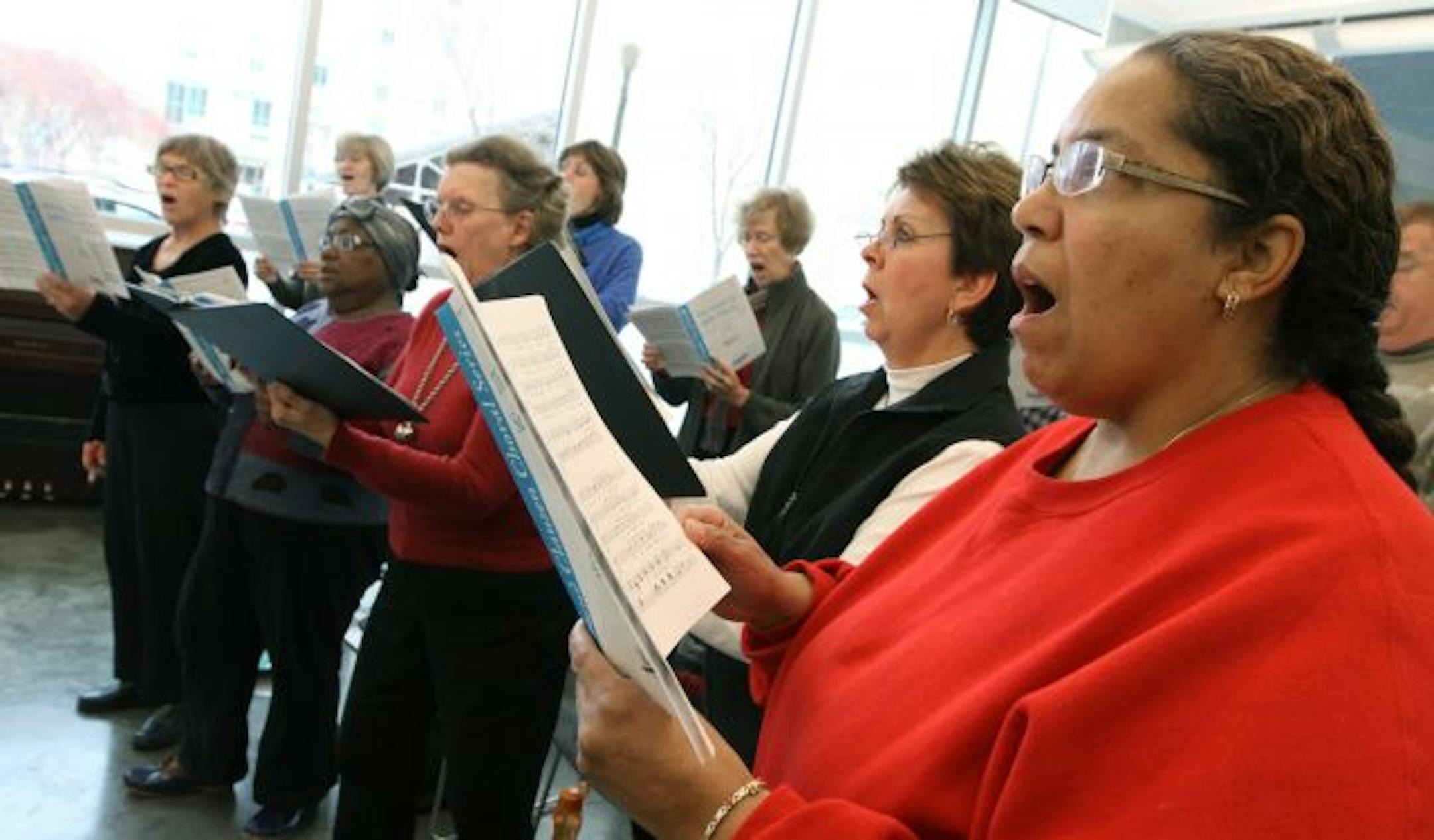 Cassandra Warn, right, and other members of the Voices of Experience rehearsed at the MacPhail Center for Music.