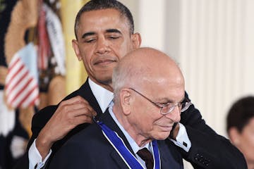 U.S. President Barack Obama awards the Presidential Medal of Freedom to psychologist Daniel Kahneman in the East Room at the White House on Nov. 20, 2