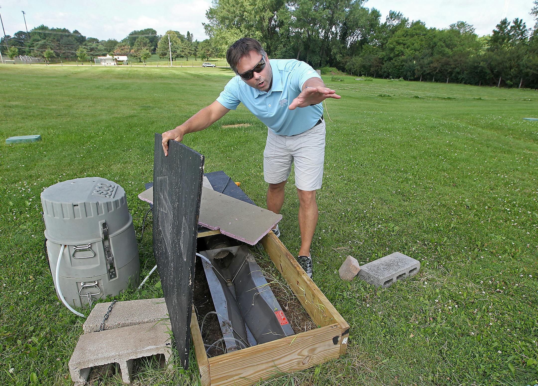 Turfgrass specialist Brian Horganstudy showed how the water is used at one of the testing plots at the U of M, Friday, July 17, 2015 in Falcon Heights, MN. ] (ELIZABETH FLORES/STAR TRIBUNE) ELIZABETH FLORES • eflores@startribune.com