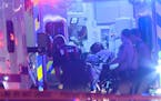 In this photo provided by KARE, a person is brought into an emergency vehicle after a shooting early Monday, Oct. 3, 2016, in Minneapolis. Minneapolis