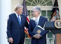 President Donald Trump, left, speaks as he announces his nominee for the chairman of the Federal Reserve, Jerome Powell, on Nov. 2, 2017, during a new