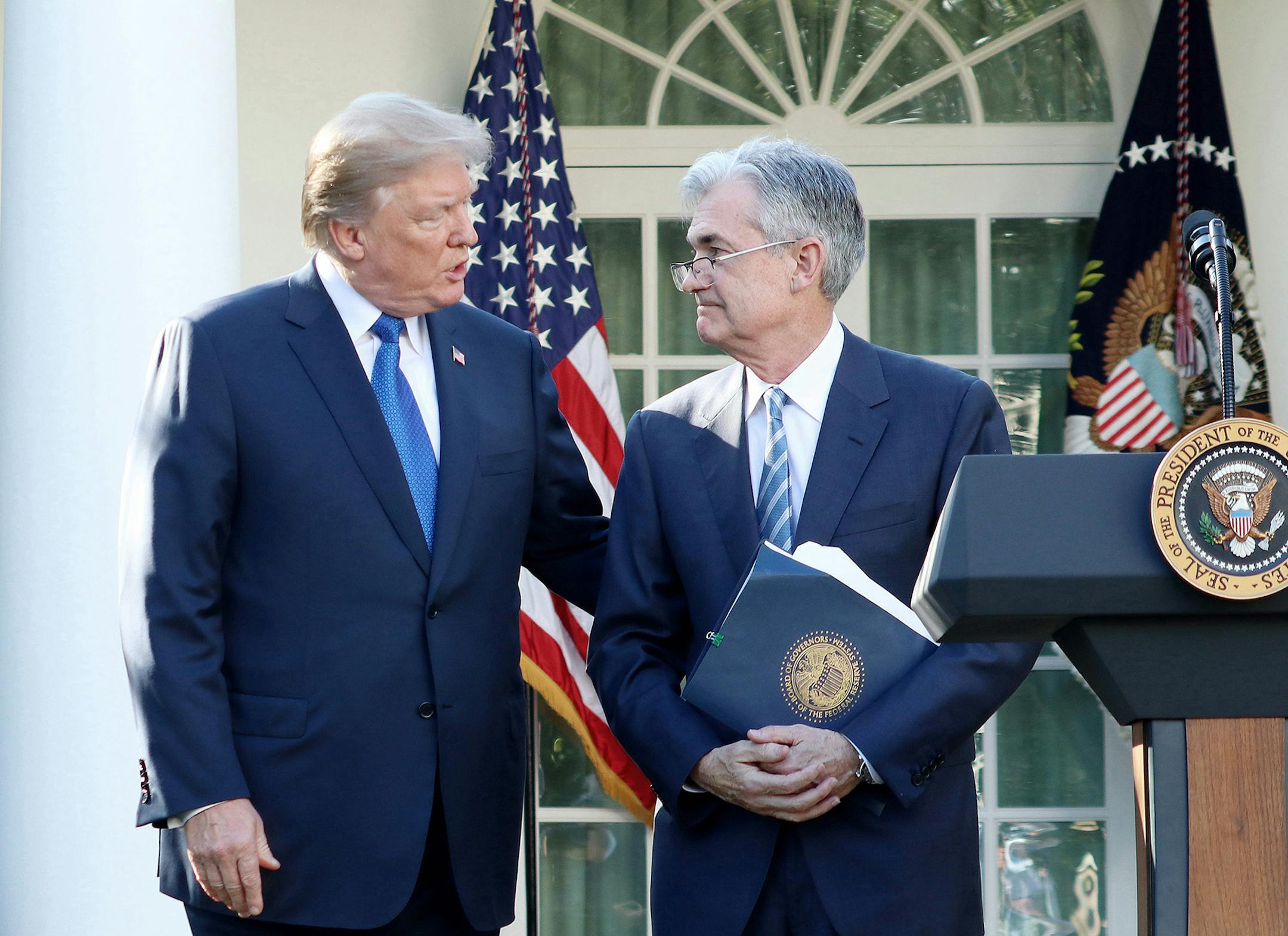 President Donald Trump, left, speaks as he announces his nominee for the chairman of the Federal Reserve, Jerome Powell, on Nov. 2, 2017, during a news event in the Rose Garden at the White House in Washington, D.C. On Aug. 23, 2019, Trump called the Federal Reserve leader an "enemy." (William Moon/Abaca Press/TNS)