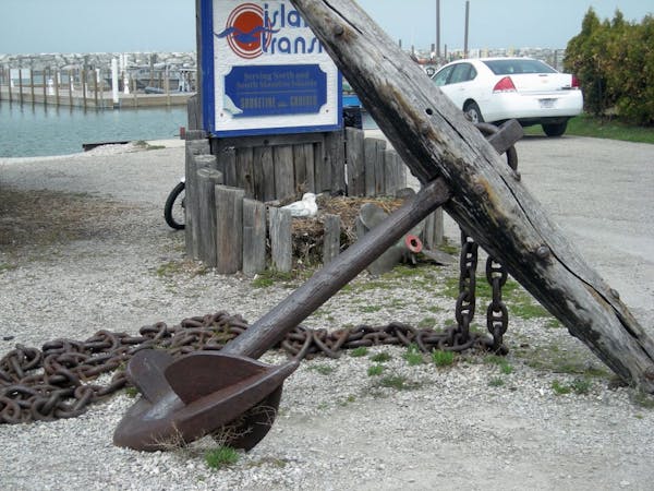 An old anchor at Fishtown reflects the maritime past of the historic commercial fishing settlement.