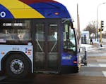 A Metro Transit C-Line bus travels along Penn Avenue in Minneapolis.