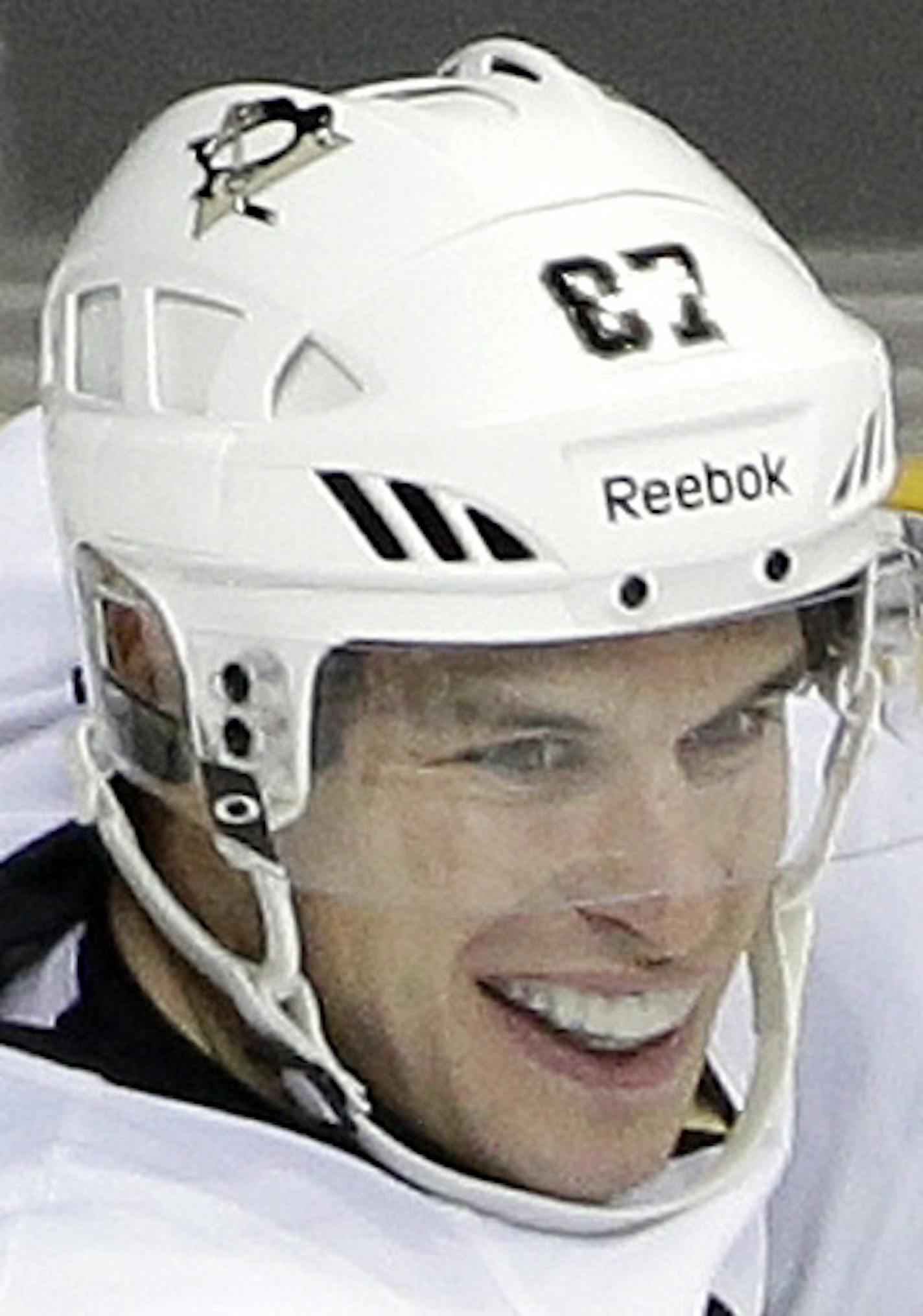 Pittsburgh Penguins right wing Pascal Dupuis (9) celebrates with Sidney Crosby (87) after Dupuis scored a goal against the Nashville Predators in the third period of an NHL hockey game Saturday, Oct. 25, 2014, in Nashville, Tenn. (AP Photo/Mark Humphrey) ORG XMIT: MIN2014103123384705